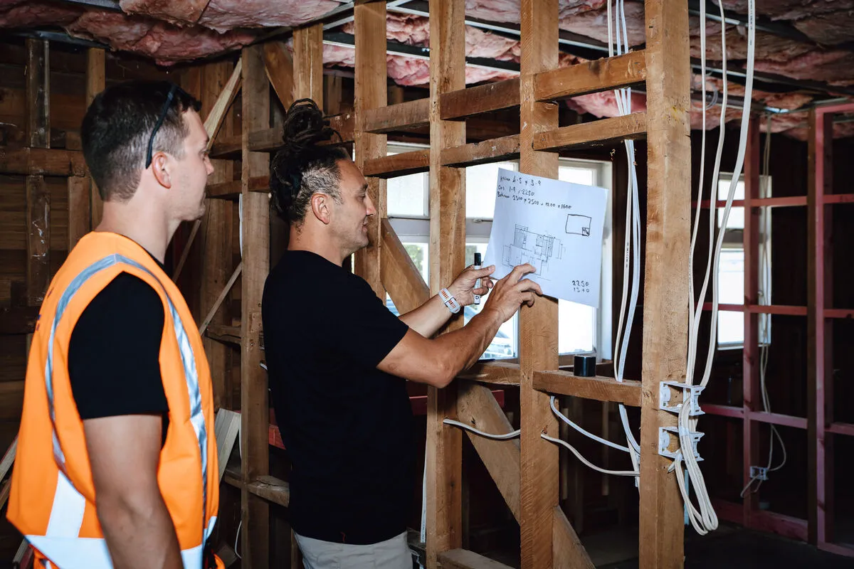 Wairau Electric team reviewing electrical plans on site